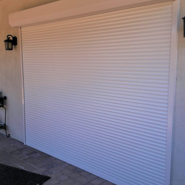 Rolling shutters protecting glass double doors of a Tucson, Arizona home
