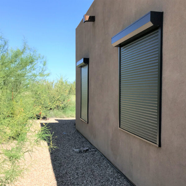 Rolling shutters on side window of a Tucson, Arizona home