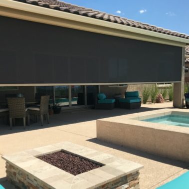 Home in Tucson, Arizona with retractable solar screens shading the patio