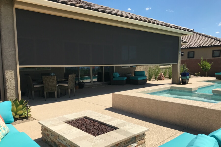 Home in Tucson, Arizona with retractable solar screens shading the patio