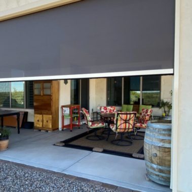 Home in Tucson, Arizona with retractable solar screens shading the patio