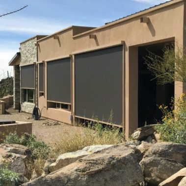 Home in Tucson, Arizona with retractable solar screens shading the patio