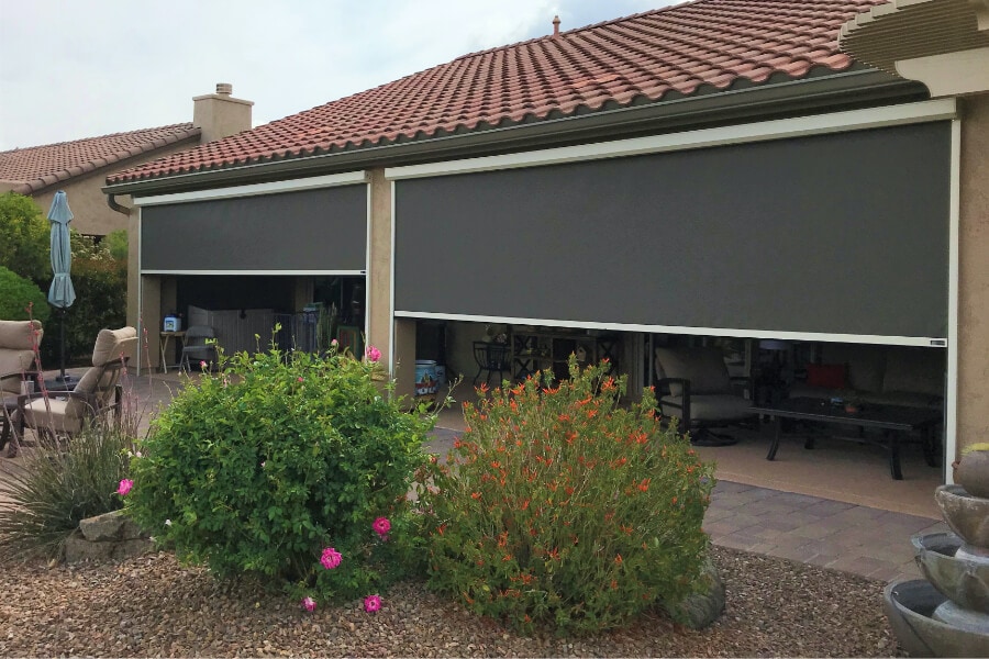 Home in Tucson, Arizona with retractable solar screens shading the patio