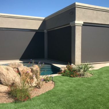 Home in Tucson, Arizona with retractable solar screens shading the patio