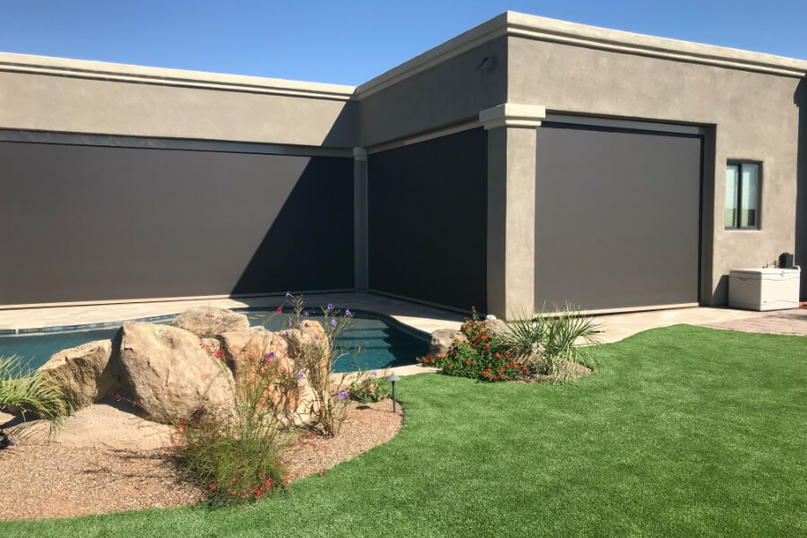 Home in Tucson, Arizona with retractable solar screens shading the patio