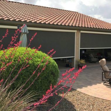 Home in Tucson, Arizona with retractable solar screens blocking the patio