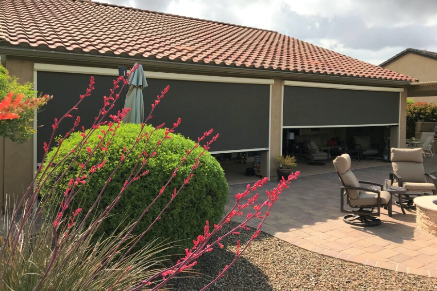 Home in Tucson, Arizona with retractable solar screens blocking the patio