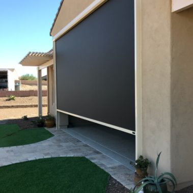 Retractable solar screen covering garage in Tucson, Arizona