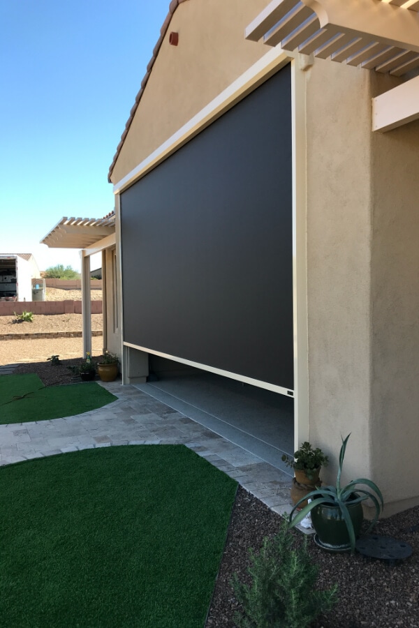 Retractable solar screen covering garage in Tucson, Arizona