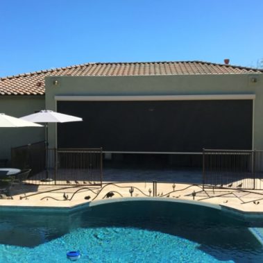 Home in Tucson, Arizona with retractable solar screens blocking the patio