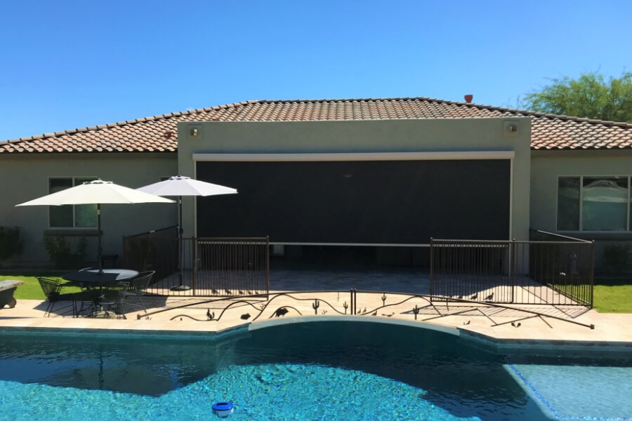 Home in Tucson, Arizona with retractable solar screens blocking the patio