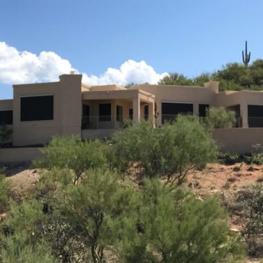 Home in Tucson, Arizona with retractable solar screens blocking the windows