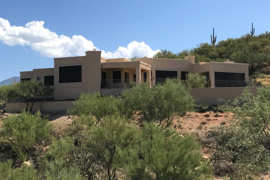 Home in Tucson, Arizona with retractable solar screens blocking the windows
