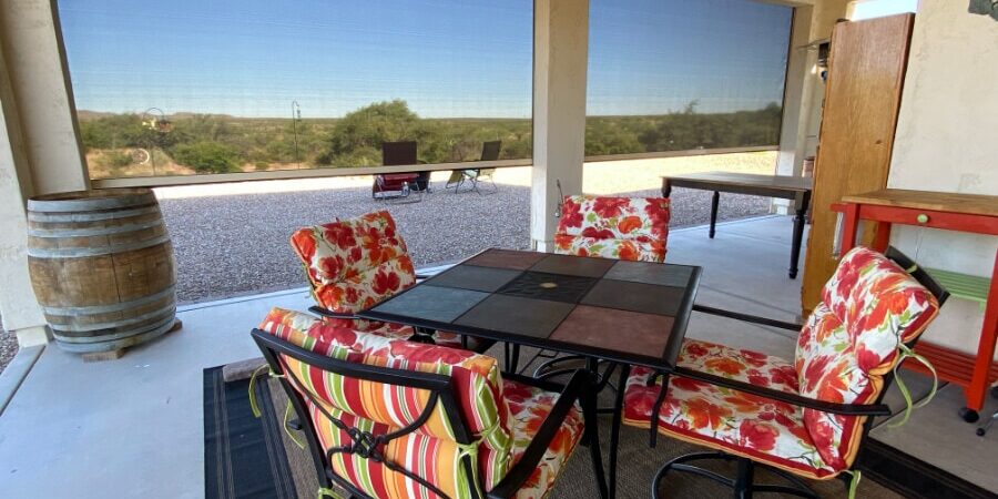 Retractable solar screens shading the patio of a Tucson, Arizona home