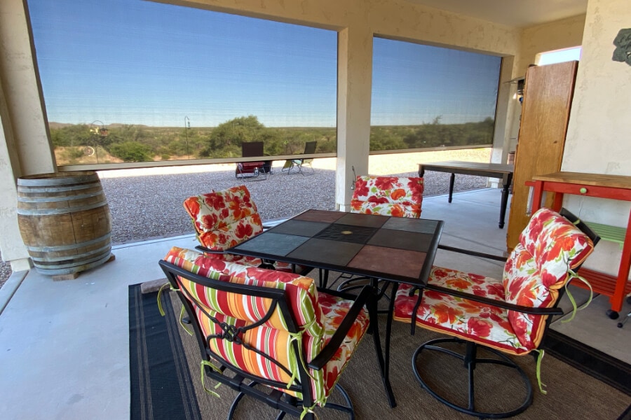 Retractable solar screens shading the patio of a Tucson, Arizona home