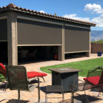 Solar screens protecting backyard patio furniture