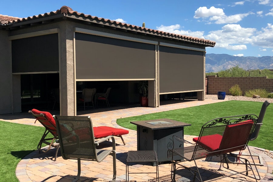 Solar screens protecting backyard patio furniture