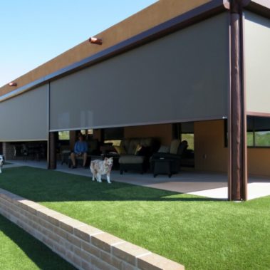 Retractable solar screens shading the patio of a Tucson, Arizona home