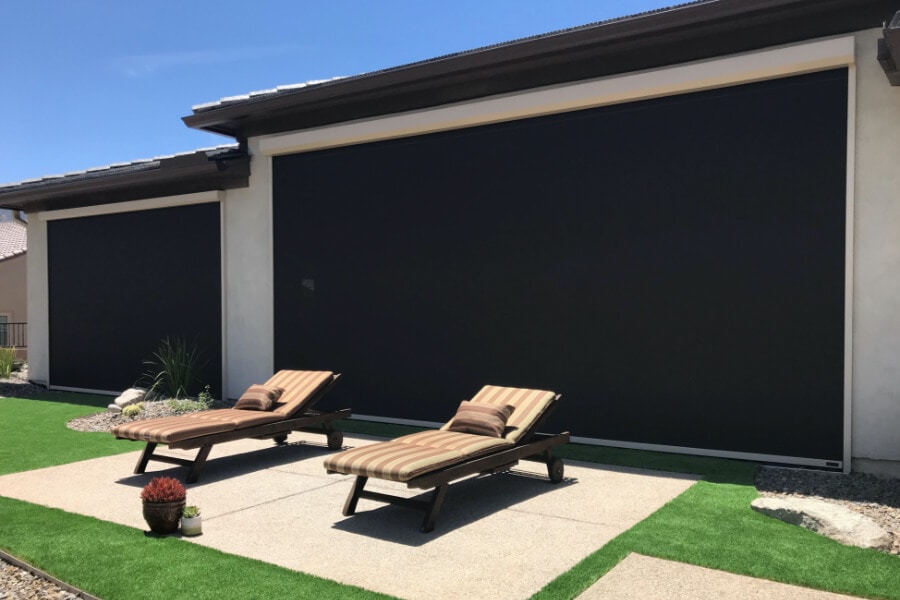 Retractable solar screens shading the patio of a Tucson, Arizona home