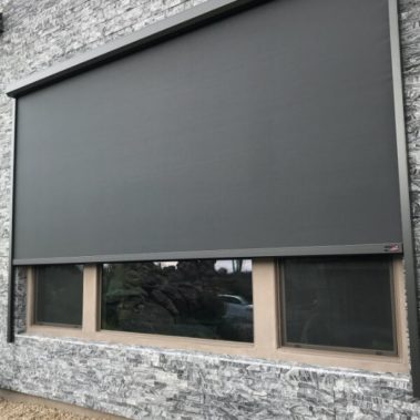 Home in Tucson, Arizona with retractable solar screens shading the windows