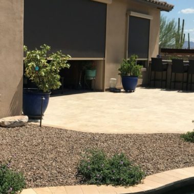 Home in Tucson, Arizona with retractable solar screens shading the patio