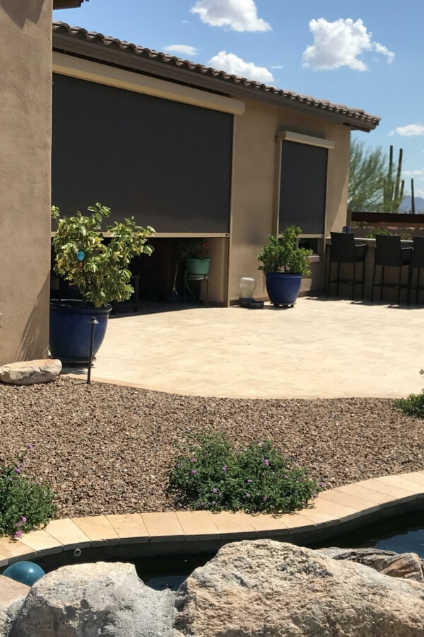 Home in Tucson, Arizona with retractable solar screens shading the patio