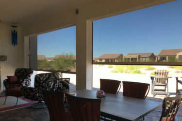 Home in Tucson, Arizona with retractable solar screens shading the patio