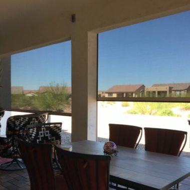 Home in Tucson, Arizona with retractable solar screens shading the patio