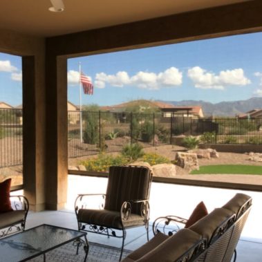 Home in Tucson, Arizona with retractable solar screens shading the patio