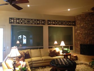 Exterior rolling shutters providing room darkening for a Tucson, Arizona home