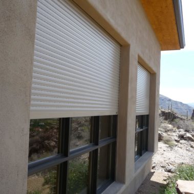 Exterior shades protecting windows of a home