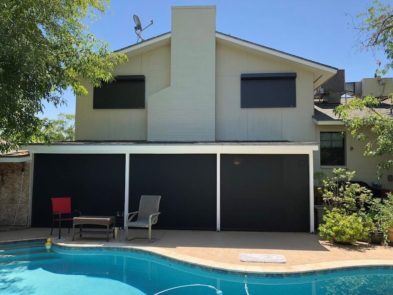 Rolling shutters protecting window of a Tucson, Arizona home