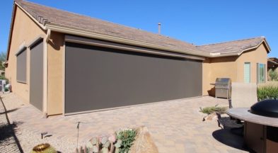 Extra large rolling screen shading patio of a Tucson, Arizona home