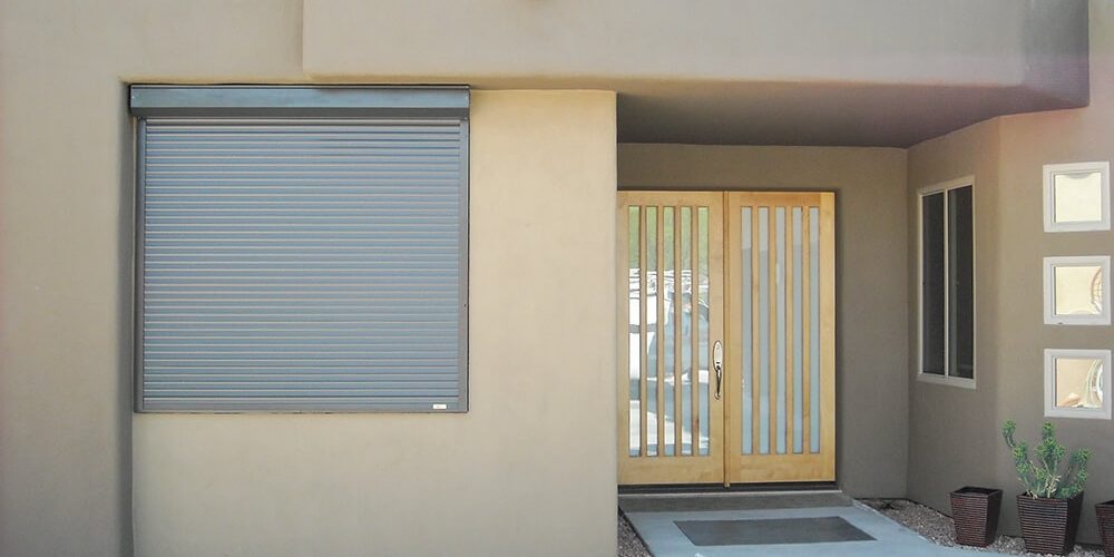 Rolling shutters protecting windows of a Tucson, Arizona home