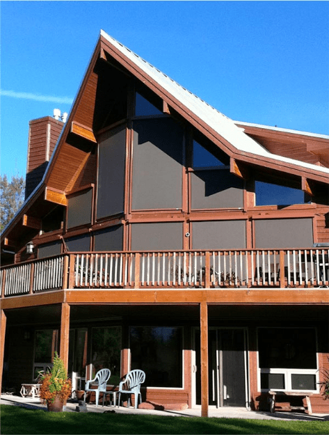 Solution screens covering windows behind an exterior deck