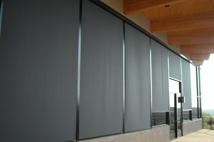 Rolling screens covering the windows of a Tucson, Arizona home