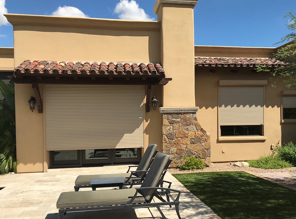Scottsdale Rolling Shutters Rolling shutters protecting the glass doors and windows of a Tucson, Arizona home