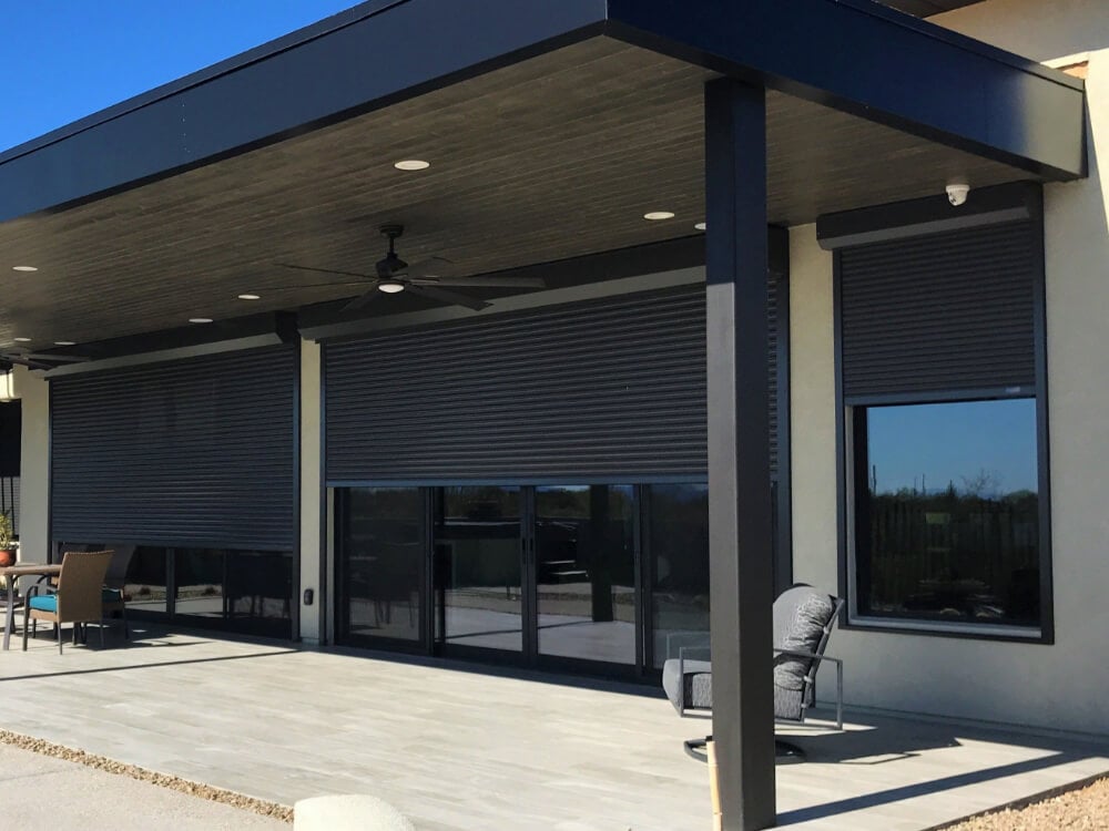 Rolling shutters protecting double doors in a Tucson backyard